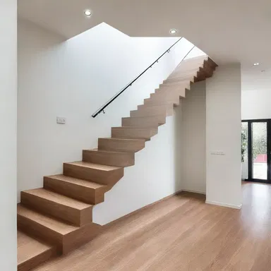 The sleek and modern staircase in the house was designed to hold tight to the wall, creating a stunning focal point.