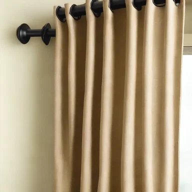 The designer incorporated cringles into the curtains to easily attach them to the curtain rods.