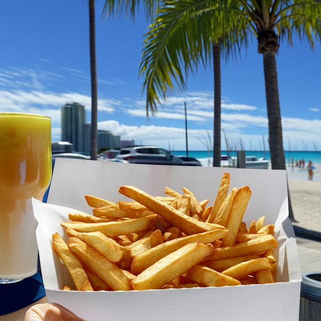 A lively fish and chip shop located in Mooloolaba, Queensland, Australia with a stunning beach view