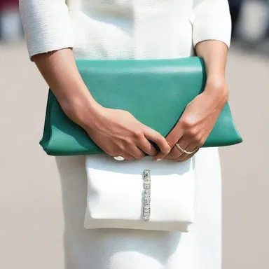 The bivalve clutch bag she accessorized with added a touch of elegance to her overall outfit.