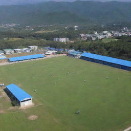 A picturesque view of Dungsam Football Academy; green football fields, students in sporty attire, coaching staff and training sessions in full effect under a clear blue sky.