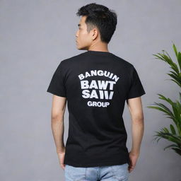 Black t-shirt with the words 'bangun sawit group' printed prominently on the back in bold, white letters.