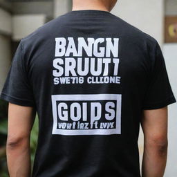 Black t-shirt with the words 'bangun sawit group' printed prominently on the back in bold, white letters.