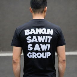 Black t-shirt with the words 'bangun sawit group' printed prominently on the back in bold, white letters.