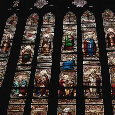 The cathedral's stained glass windows were magnificently crafted, depicting scenes from the Bible.