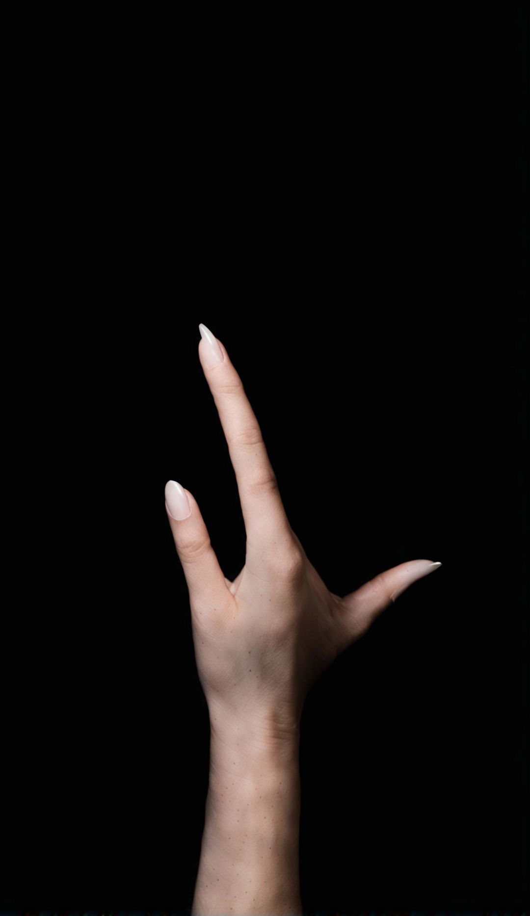 A pale hand reaches out from an abyss of darkness towards the viewer.