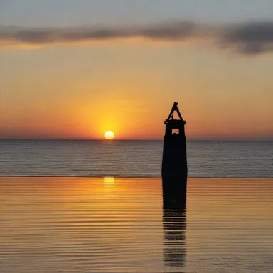 As the sun set on the horizon, the sound of the bell buoy in the distance added a romantic touch to the evening.