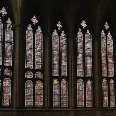 The medieval cathedral was adorned with beautiful stained glass lancet windows, symbolizing the divine light shining through.