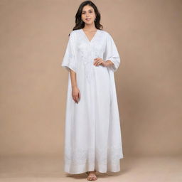 An elegant, free size kaftan-style prayer dress in white, adorned with modern, intricate embroidery.