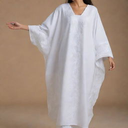 An elegant, free size kaftan-style prayer dress in white, adorned with modern, intricate embroidery.