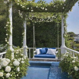 A visually stunning garden dominated by a deep cerulean blue theme, housing a ginormous swing draped in soothing white florals, and a lavish balcony overlooking this tranquil setting.