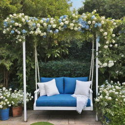 A visually stunning garden dominated by a deep cerulean blue theme, housing a ginormous swing draped in soothing white florals, and a lavish balcony overlooking this tranquil setting.