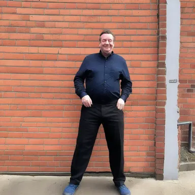 The comedian made a hilarious joke about a clumsy construction worker accidentally demolishing a cavity wall.