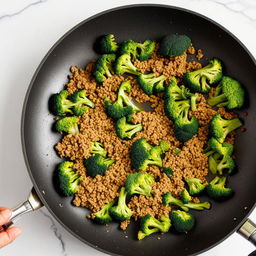 (continue) Step 2: Place the mince and broccoli into a large pan, stir-fry with oil for 3 minutes