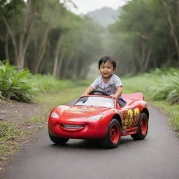 A 3 year old Balinese boy joyously riding a Lightning McQueen car toy amidst a tropical setting