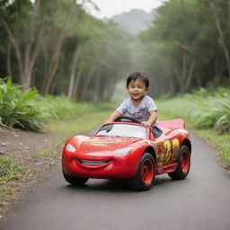 A 3 year old Balinese boy joyously riding a Lightning McQueen car toy amidst a tropical setting