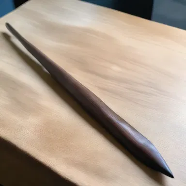 The talented artist skillfully sculpted a lifelike replica of a spear, showcasing its beauty and functionality in her artwork.