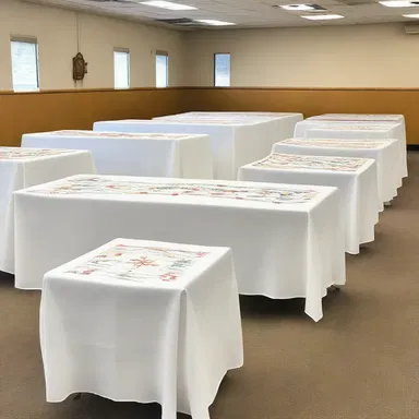 As part of a fundraising initiative, the church organized a white sale of embroidered tablecloths and religious themed linens.