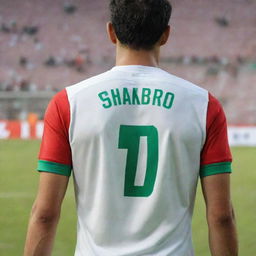 The back of an Algerian soccer kit named SHAKIBO with the number 7 on it. The wearer has medium-length hair, normal skin tone, and a medium build.