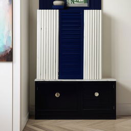 White and blue fluted shutters forming a storage unit located above a sleek black marble side table