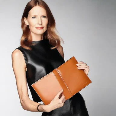 The fashion designer carried a stylish leather pad to jot down their creative ideas.