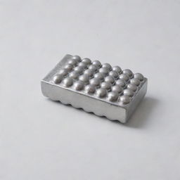 A large eraser studded with shiny metal ball bearings