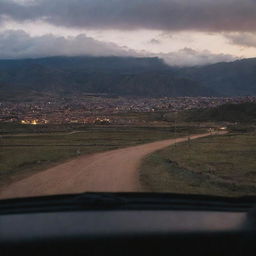 A late evening rear view shot from inside a car, leaving Cusco and driving towards a distant village, as night gradually descends.