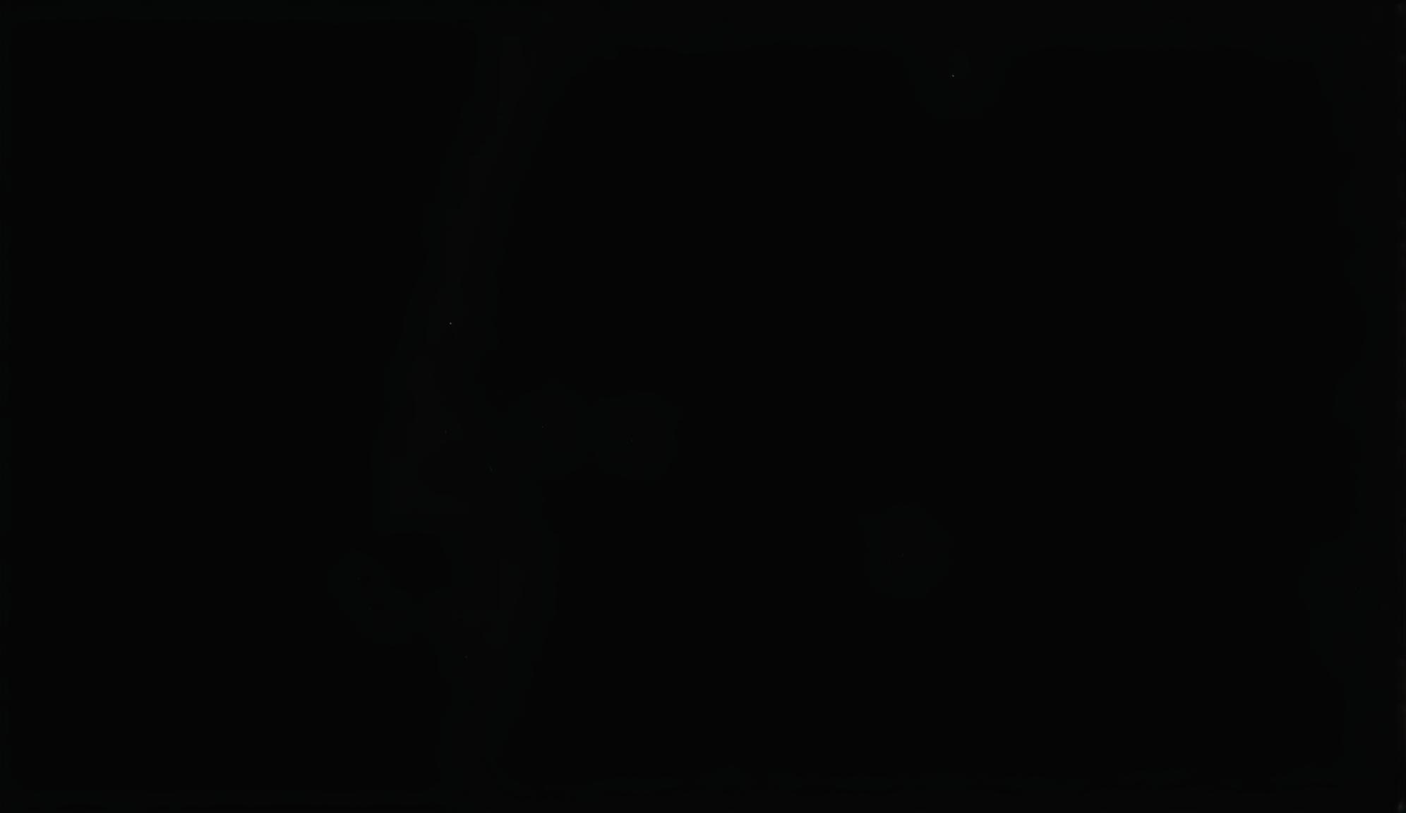 A plain black image with no additional elements or colors.