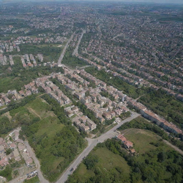 Aerial view of Avdiivka, Ukraine showing the urban landscape, residential buildings, streets, and surrounding nature in daytime.