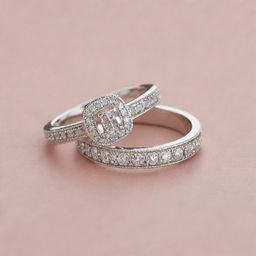 Two matching silver engagement rings encrusted with sparkling diamonds. One ring features an exquisite design of the letter 'J' and the other echoes this design but with the letter 'R'.