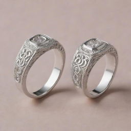 Two similar silver engagement rings. The first one, feminine style, with the letter R intricately crafted on it. The second one, masculine style, with the letter J elegantly etched onto it.