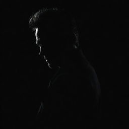 Create a stark image of a mysterious silhouette of a man set against a dark, black background