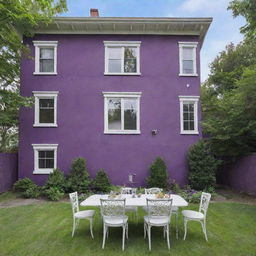 A three-story house with purple walls, featuring white windows and doors. Nestled in the yard are a white table and chairs.