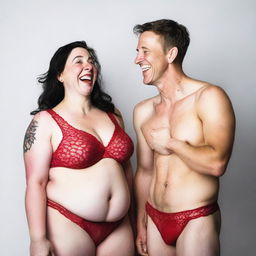 A skinny and effeminate white man wearing a red lace bra and panties, standing confidently