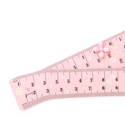 A pretty pink girly ruler designed for measuring in inches, with elegant, feminine design elements intended for a mature audience