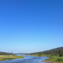 A serene landscape with a clear blue sky, a flowing river, and a forest in the background