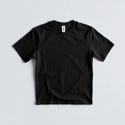 A simple black t-shirt displayed on a plain background