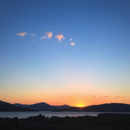 A serene landscape featuring a beautiful sunset over a calm lake with mountains in the background and a few scattered clouds in the sky