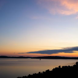 sunset over a tranquil lake with a silhouette of a lone sailboat