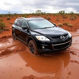 A black 2009 Mazda CX-9 stuck in mud in the Australian outback