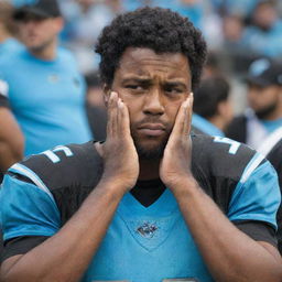 A Carolina Panthers fan appearing dejected and sad, decked out with team colors and accessories