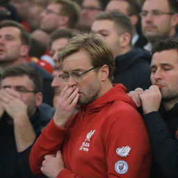 An extremely emotive scene showing deeply saddened Liverpool fans, tears streaming down their faces, following Klopp's announced departure.