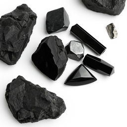 A striking arrangement of black tourmaline, obsidian, hematite, and Apache tear crystals on a pristine white background