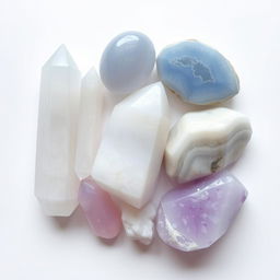 A beautiful array of selenite, blue lace agate, howlite, and lepidolite crystals displayed on a white background