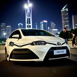 A sleek Toyota Vios Gen 3, parked under a bright city skyline