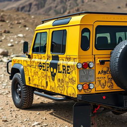 A striking yellow Land Rover Defender 110 with a pickup configuration, featuring a bold black Apache sticker on the side