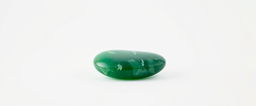 A single piece of green aventurine displayed on a pure white background