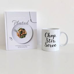 A beautifully designed book with the title "Plated Perfection" on the cover, elegantly displayed beside a stylish mug