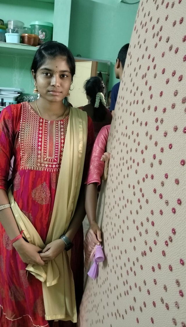 Two women standing side by side in traditional Indian attire