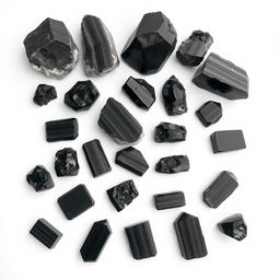 A striking assortment of Black Tourmaline crystals, featuring both raw and polished forms, displayed on a pure white backdrop